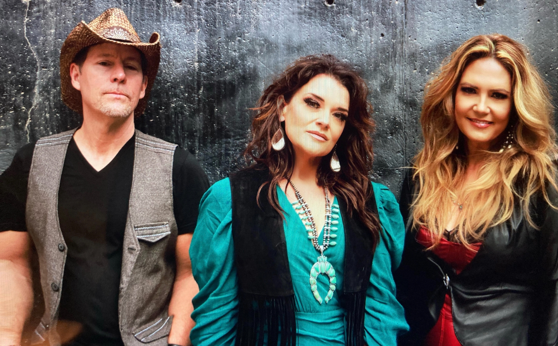 Heroes & Wreckers members Jesse Romigh, Ashley Allison, and Dālene Richelle in a promotional portrait.